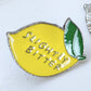 Slightly bitter enamel pin