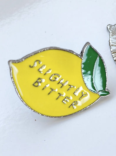 Slightly bitter enamel pin
