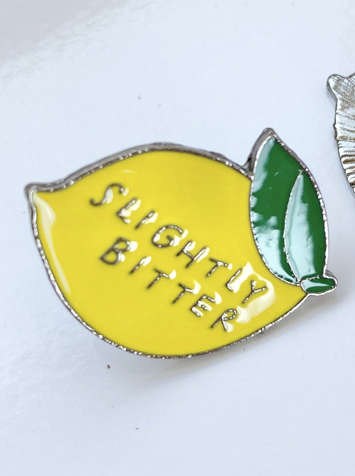 Slightly bitter enamel pin