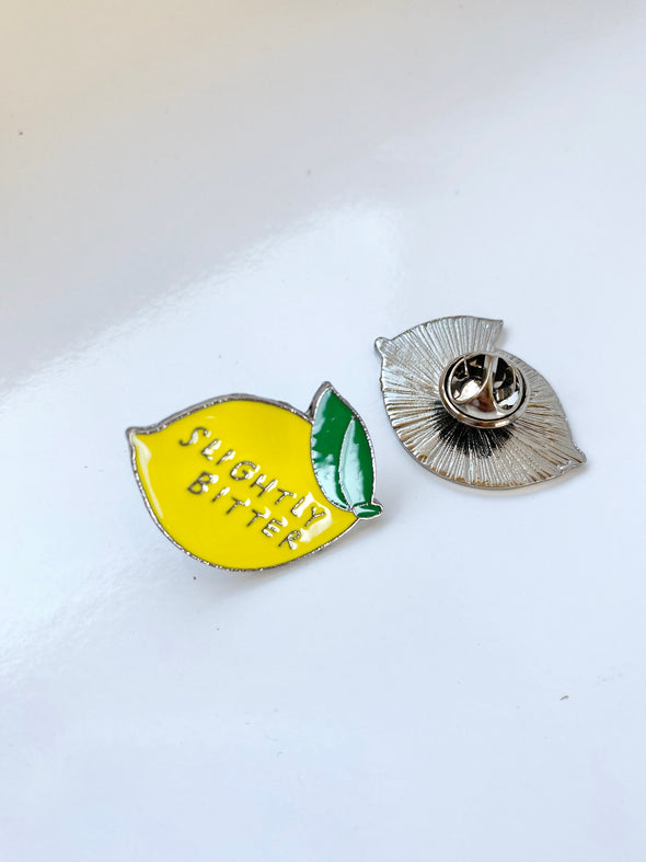 Slightly bitter enamel pin
